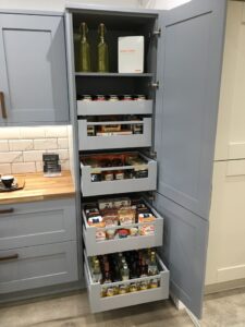 Pull-out pantry system for maximizing small kitchen spaces