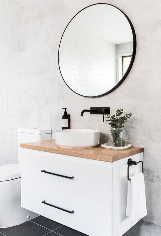White floating vanity made from PVC Moisture-Resistant Bathroom Cabinets with wood countertop and round mirror