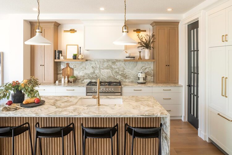 Modern kitchen design in Calgary featuring stylish RTA Cabinets with marble island and wood accents