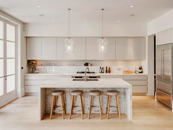 Modern Canadian kitchen featuring sleek RTA Cabinets with marble island and minimalist design