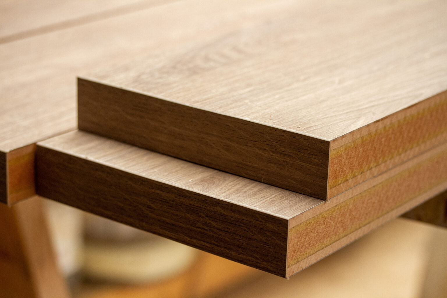 Close-up of wood panels with edge banding showing protected edges and layered structure