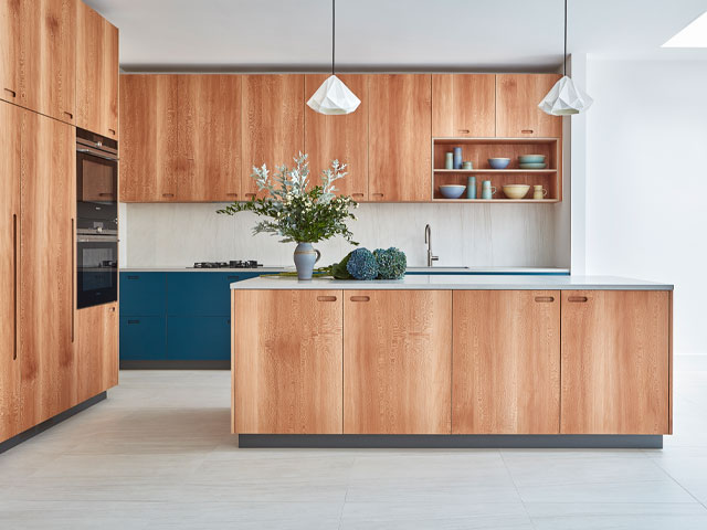 Modern kitchen with natural wood engineered cabinets and island featuring protective coatings for engineered wood cabinets to ensure durability, style, and long-lasting protection.