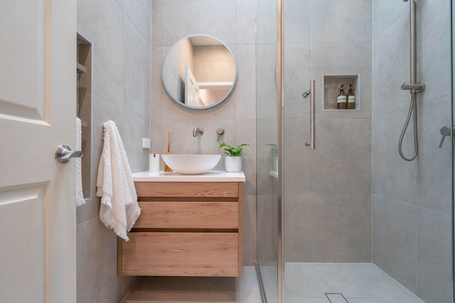 Floating bathroom cabinets for small bathrooms with modern wood vanity and integrated sink