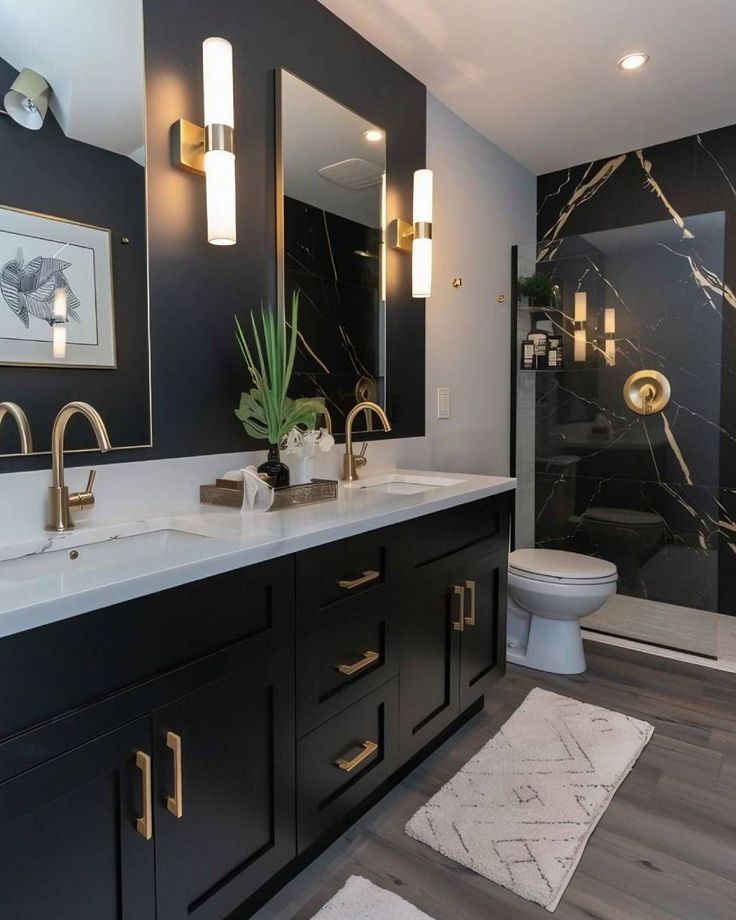 Luxury bathroom with Black Bathroom Cabinets, white quartz countertop, gold hardware, and black marble shower wall