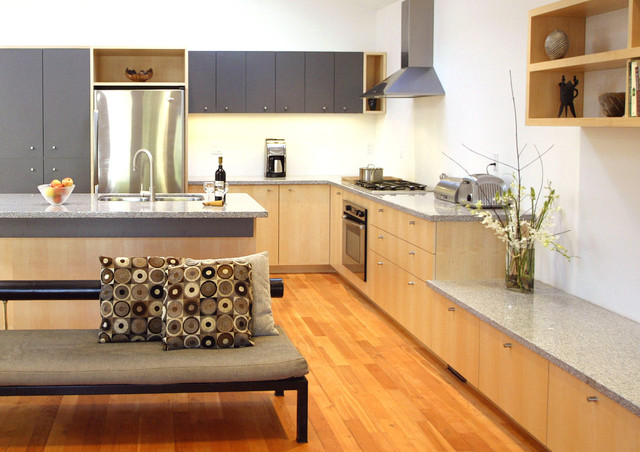 Modern minimalist kitchen with Eco-Friendly Kitchen Cabinets in FSC-certified maple, gray uppers, and quartz-style countertops
