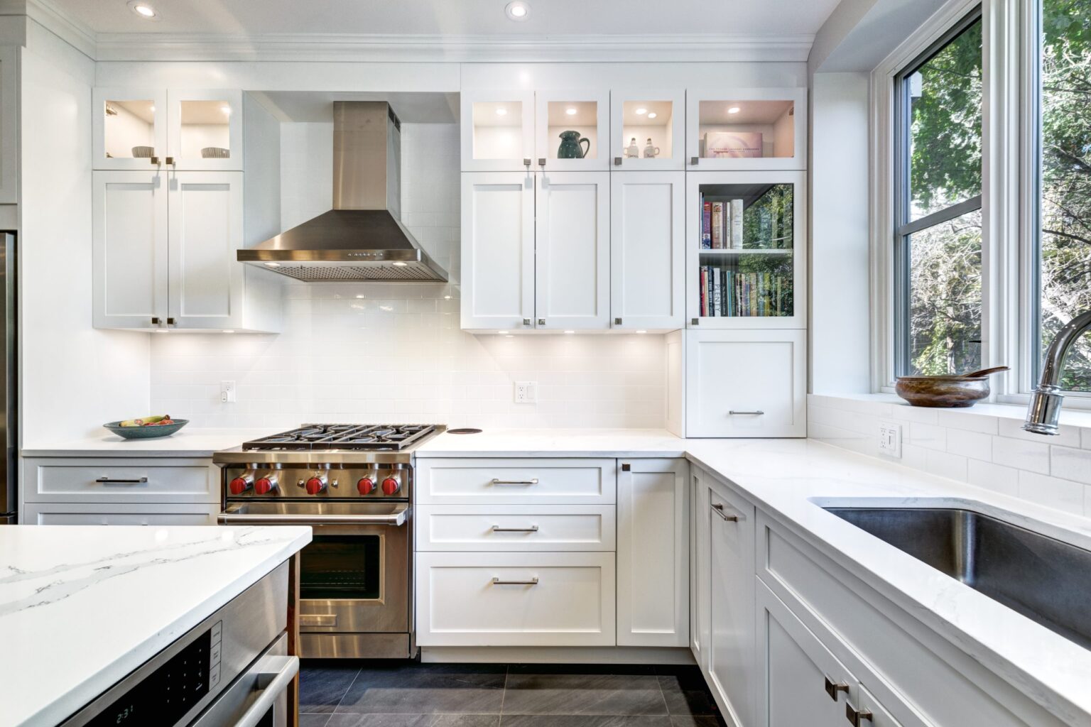 Bright white kitchen design showcasing the quality of Canadian RTA cabinets with shaker doors and quartz countertops