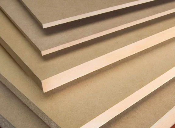 Stack of MDF panels used as a durable core material for kitchen cabinet doors and shelves.