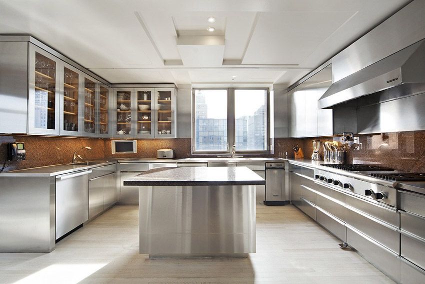 Modern stainless steel kitchen cabinet design in a bright contemporary city apartment