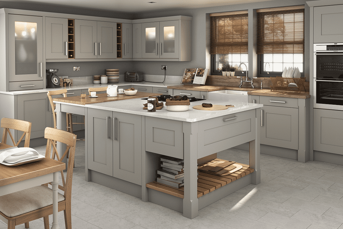 Spacious kitchen interior featuring a light grey Shaker-style flat pack kitchen cabinet set with a large central island, butcher block accents, and open shelving storage.