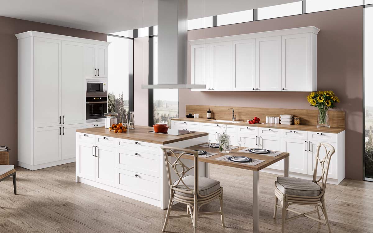 Flat pack kitchen cabinet setup in a bright modern kitchen with white shaker doors, a large island, wood countertops, and built-in wall ovens.