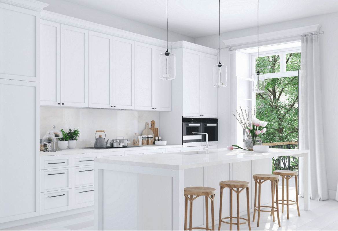 Bright white kitchen with flat-panel cabinets, large island, pendant lights, and natural daylight — Kitchen cabinet Mississauga.