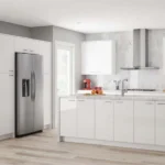 Minimalist Design white flat-panel kitchen cabinets with large island and stainless appliances