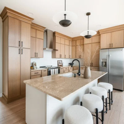 Low price kitchen cabinet set with white shaker doors, large island, and stainless steel appliances