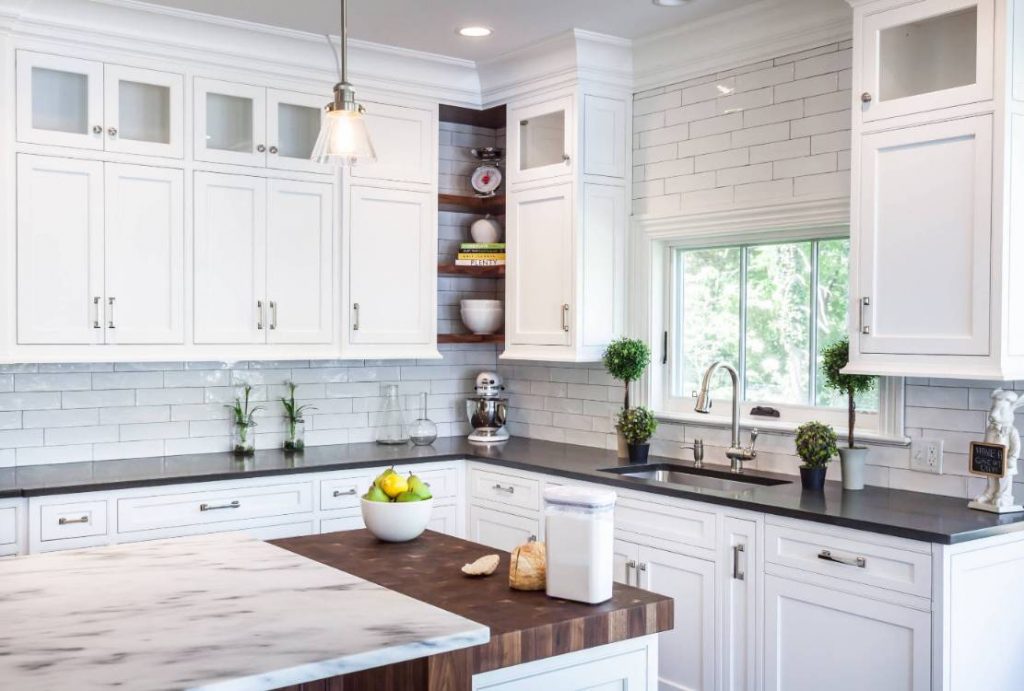 Premium ready-to-assemble kitchen cabinets in white shaker style with subway tile backsplash