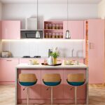 Low price kitchen cabinet set in a modern pink kitchen with island