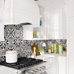 Low price kitchen cabinet in white shaker style with black-and-white patterned tile backsplash