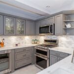 Modern grey kitchen cabinets from a kitchen cabinet supplier for basement kitchen renovation in Toronto