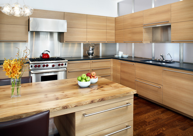 Modern flat-panel wood kitchen with island and black countertops — RTA kitchen cabinets Ontario