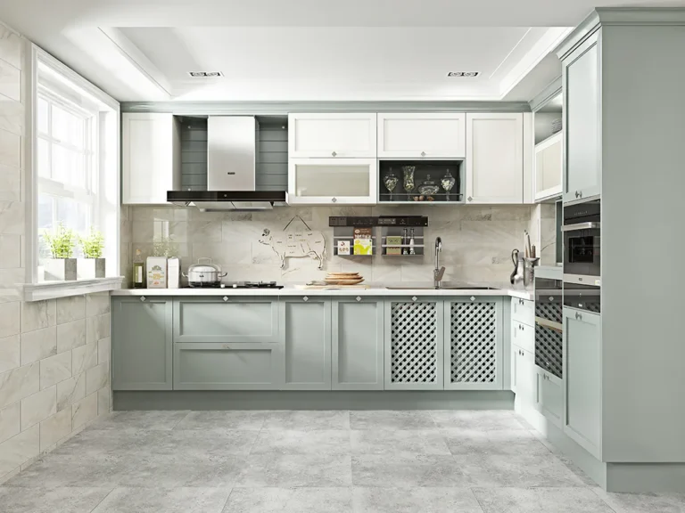 Premade kitchen cabinet design with sage green base units, white upper cabinets, and built-in oven wall in a bright modern kitchen.