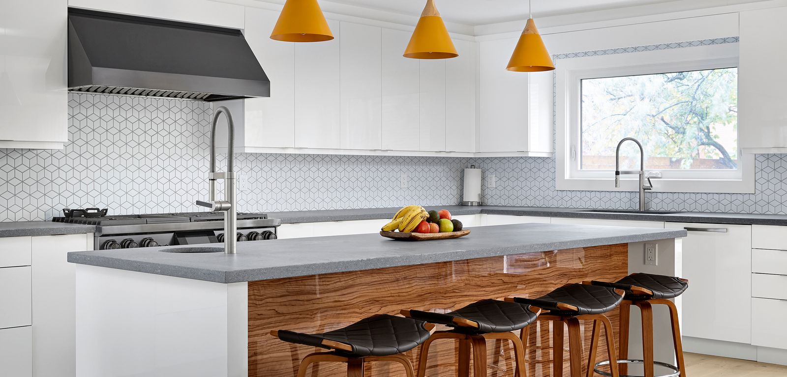 Modern white kitchen cabinets in Markham with a large island, geometric backsplash, and pendant lighting