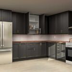 L-shaped kitchen with dark shaker IKEA kitchen cabinets, brass pulls, wood countertops, and stainless steel appliances.