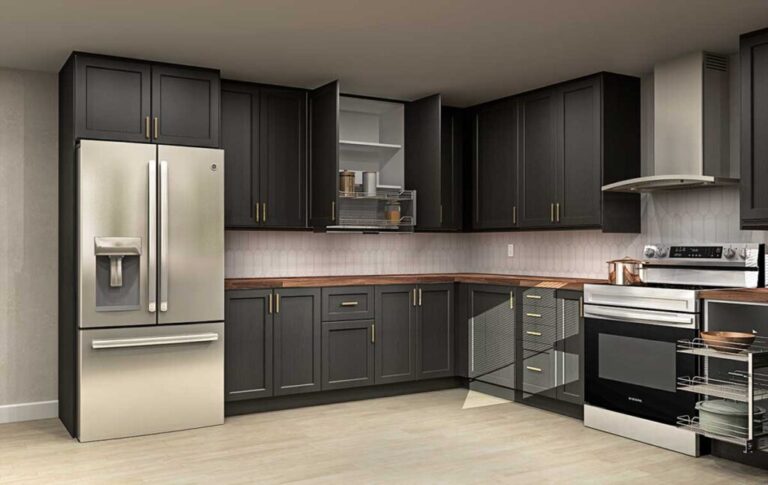 L-shaped kitchen with dark shaker IKEA kitchen cabinets, brass pulls, wood countertops, and stainless steel appliances.