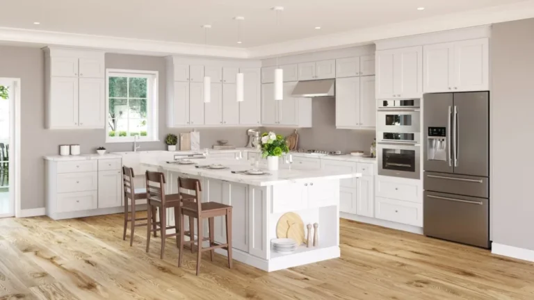 Bright modern kitchen featuring white shaker kitchen cabinets, a large central island, stainless steel appliances, and warm wood flooring in a stylish Kitchen Cabinets Hamilton design.