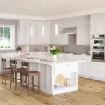 Bright modern kitchen with white shaker Kitchen Cabinets Vaughan, large center island, stainless steel appliances, and warm wood flooring.