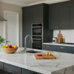 Modern Kitchen Cabinets Vaughan design featuring dark shaker cabinets, white marble island countertops, built-in ovens, and elegant brass hardware in a bright contemporary kitchen.