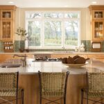 RTA kitchen cabinets Toronto GTA – warm wood kitchen with large island, stainless appliances, and big window