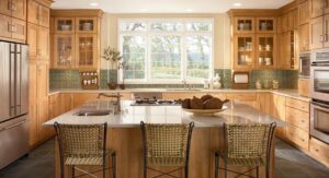 RTA kitchen cabinets Toronto GTA – warm wood kitchen with large island, stainless appliances, and big window