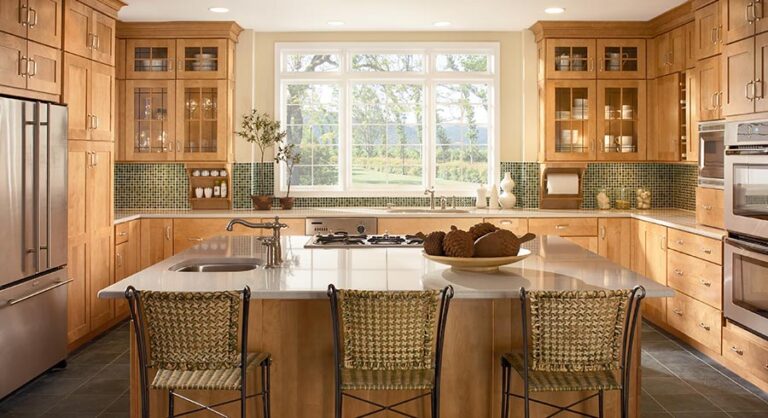 RTA kitchen cabinets Toronto GTA – warm wood kitchen with large island, stainless appliances, and big window