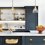 Kitchen Cabinets Oakville in a modern kitchen with navy blue shaker cabinets, open wood shelving, brass pendant lights, and a white island countertop.