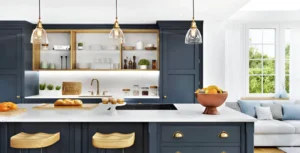 Kitchen Cabinets Oakville in a modern kitchen with navy blue shaker cabinets, open wood shelving, brass pendant lights, and a white island countertop.