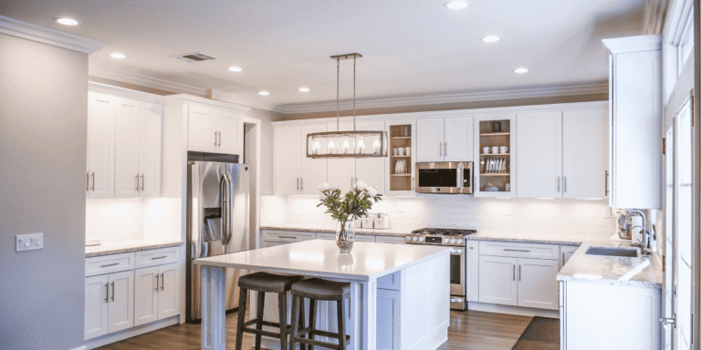 Kitchen cabinet upgrades with white shaker cabinets and modern kitchen island