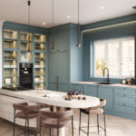 Modern teal shaker kitchen cabinets Mississauga design with glass-front pantry wall, built-in oven, and large waterfall island.