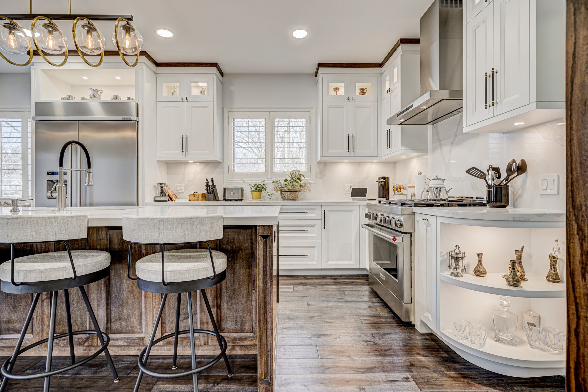 Modern white Kitchen Cabinets Etobicoke with shaker-style doors, wood island, stainless steel appliances, and open corner shelving