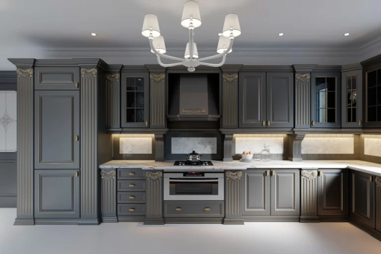 Luxury Kitchen Cabinets Oakville design with dark gray cabinetry, ornate trim, marble countertops, and warm under-cabinet lighting.