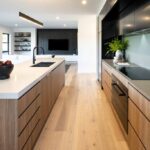 modern kitchen cabinets with wood finish and black upper cabinets