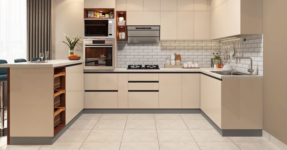 Modern L-shaped kitchen cabinets with beige finish, built-in oven, white subway tile backsplash and minimalist design