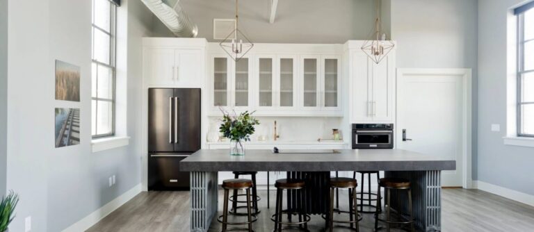 Kitchen Cabinets Brampton in a modern white kitchen with large island