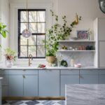 Modern Kitchen Cabinets Milton with blue cabinetry, marble countertop and natural light window