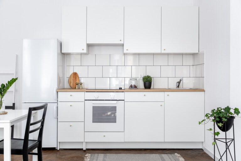 RTA kitchen cabinet solutions in Canada with modern white cabinets and wood countertop