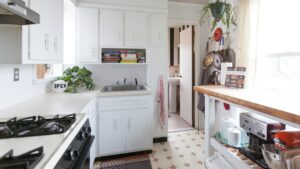 Bright white kitchen cabinet design in a small modern kitchen