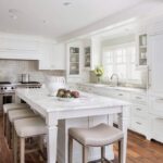 modern white kitchen cabinet doors with large island and custom storage cabinets