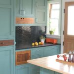 RTA kitchen cabinets in a modern kitchen with blue shaker cabinet doors and wood accents