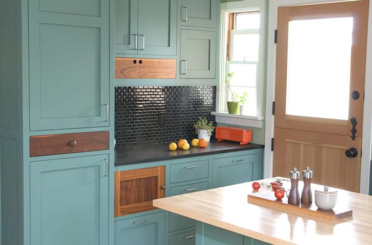 RTA kitchen cabinets in a modern kitchen with blue shaker cabinet doors and wood accents
