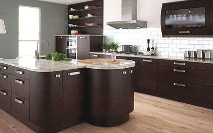 ikea kitchen cabinets in a modern dark wood kitchen with island