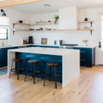 Flat pack kitchen cabinet in a modern blue and white kitchen with island