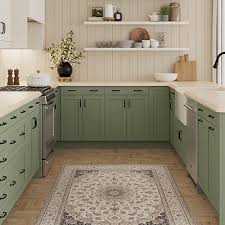 modern kitchen cabinets in sage green with shaker doors and open shelves